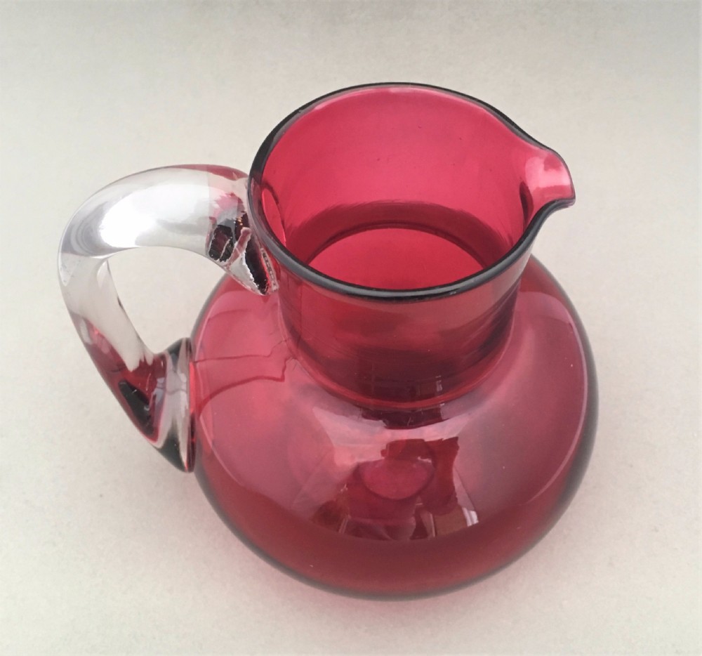 A Victorian Cranberry water jug. View IV