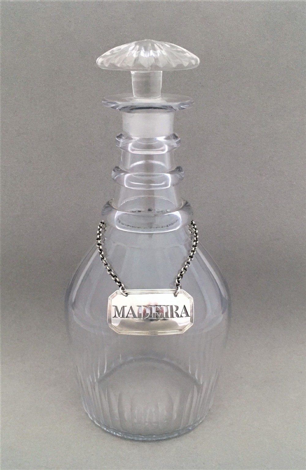 A georgian silver Madeira label and spirit decanter.