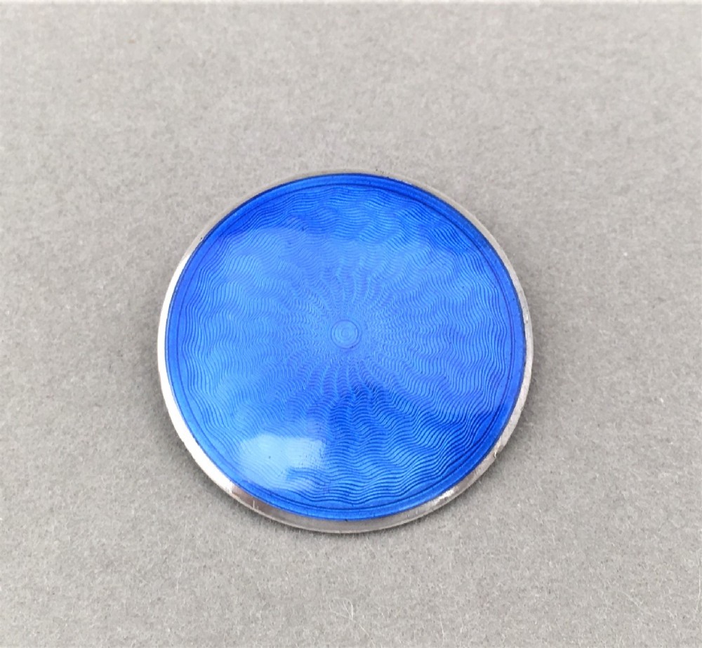 A wonderful silver and guilloche enamel brooch. 