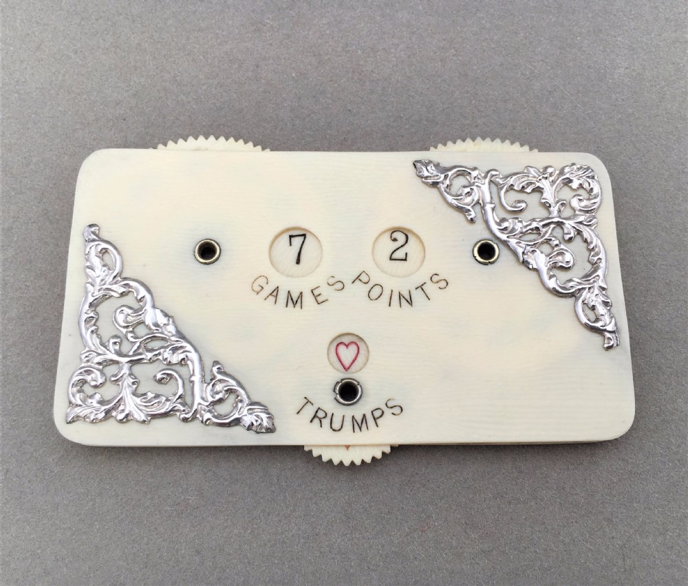 An exquisite Edwardian silver mounted trump marker.