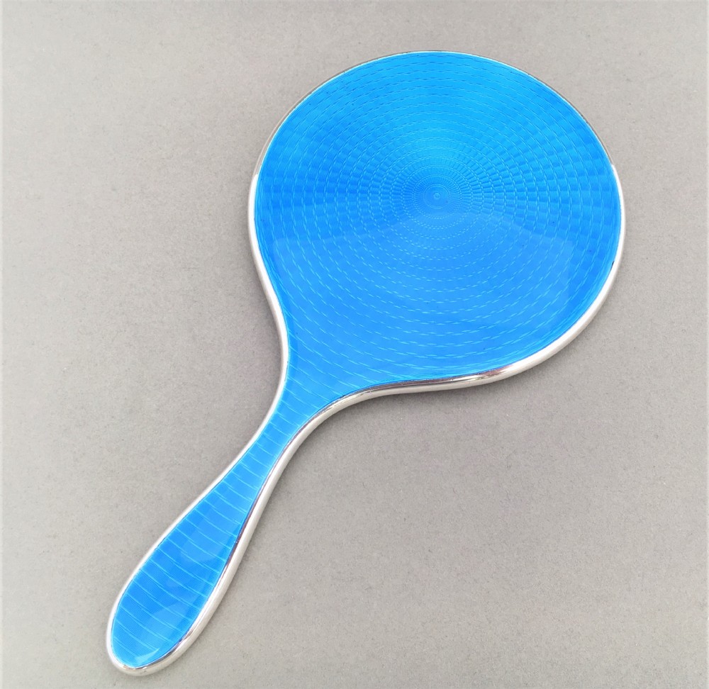 A stunning china blue silver guilloche enamel hand mirror