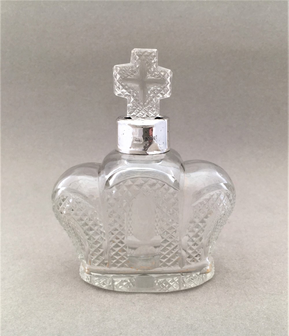 A coronation silver mounted cologne bottle. 