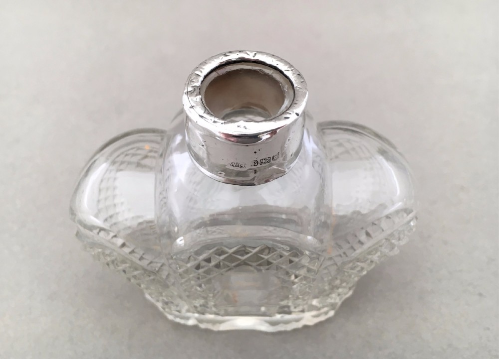 A coronation silver mounted cologne bottle.  View V