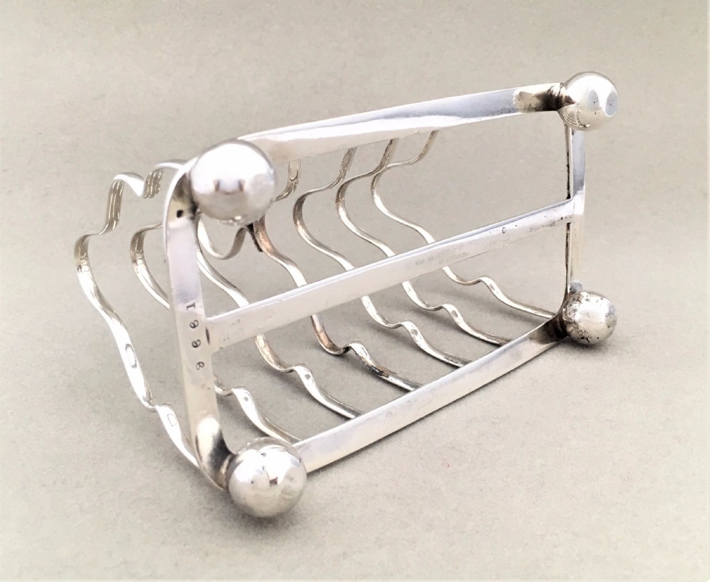 An early George V six slice silver toast rack View III