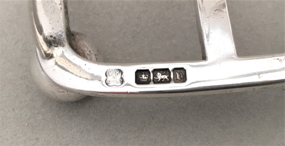 An early George V six slice silver toast rack View V