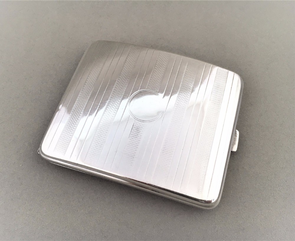 A handsome Art Deco silver cigarette case