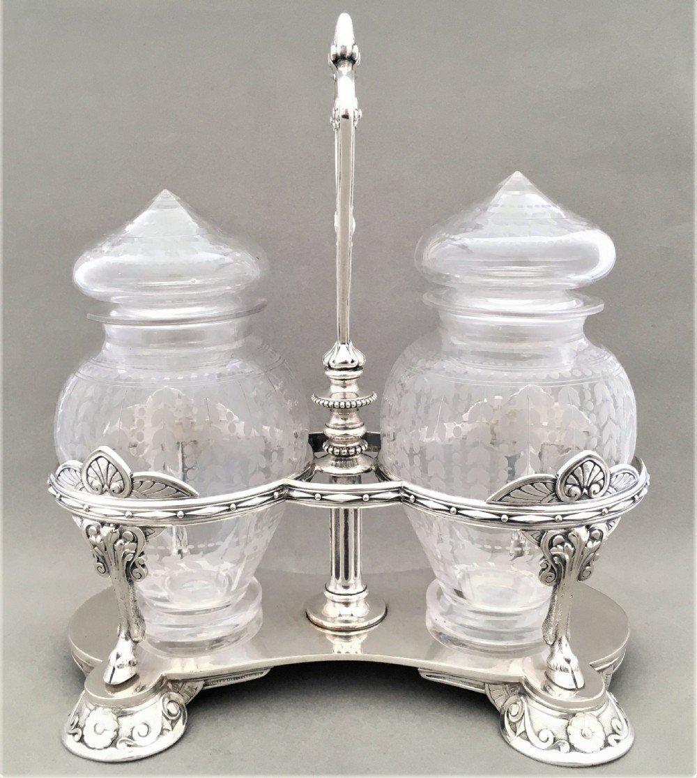 An exquisite Victorian Elkington silver plated preserve jar stand with etched jars