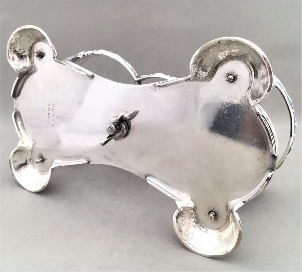An exquisite Victorian Elkington silver plated preserve jar stand with etched jars View VIII