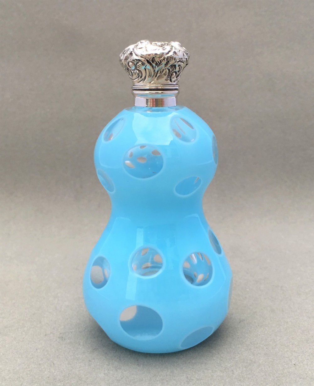 An unusual silver mounted Victorian scent bottle