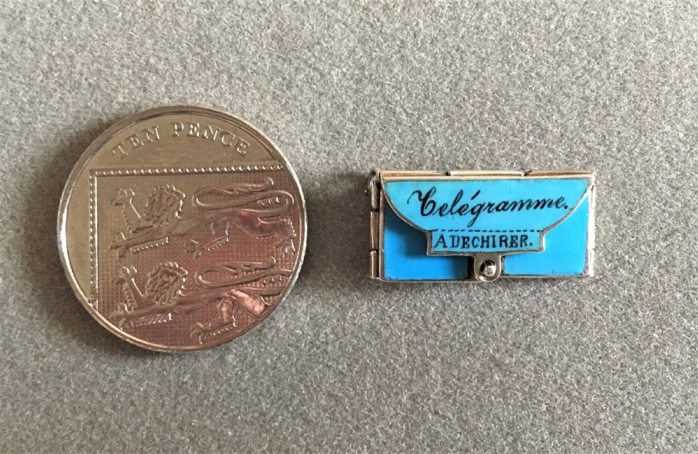 A delightful miniature French silver and enamel sweetheart charm View VII
