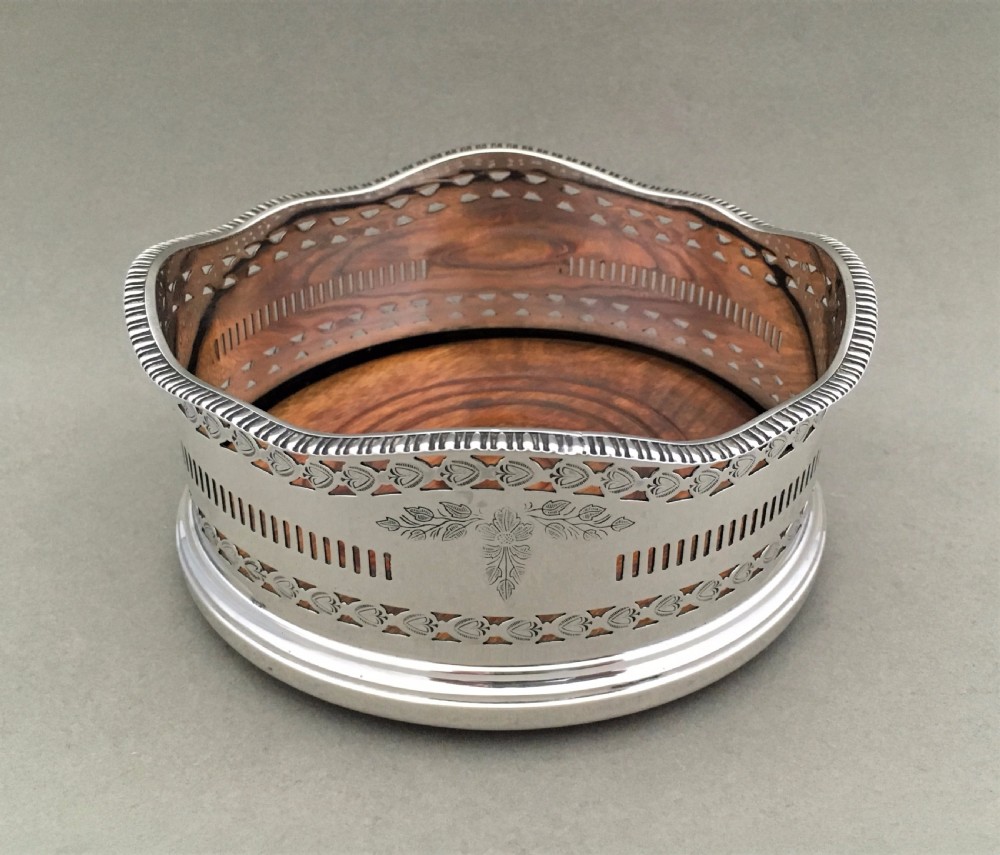 An excellent George V pierced silver wine bottle coaster View II