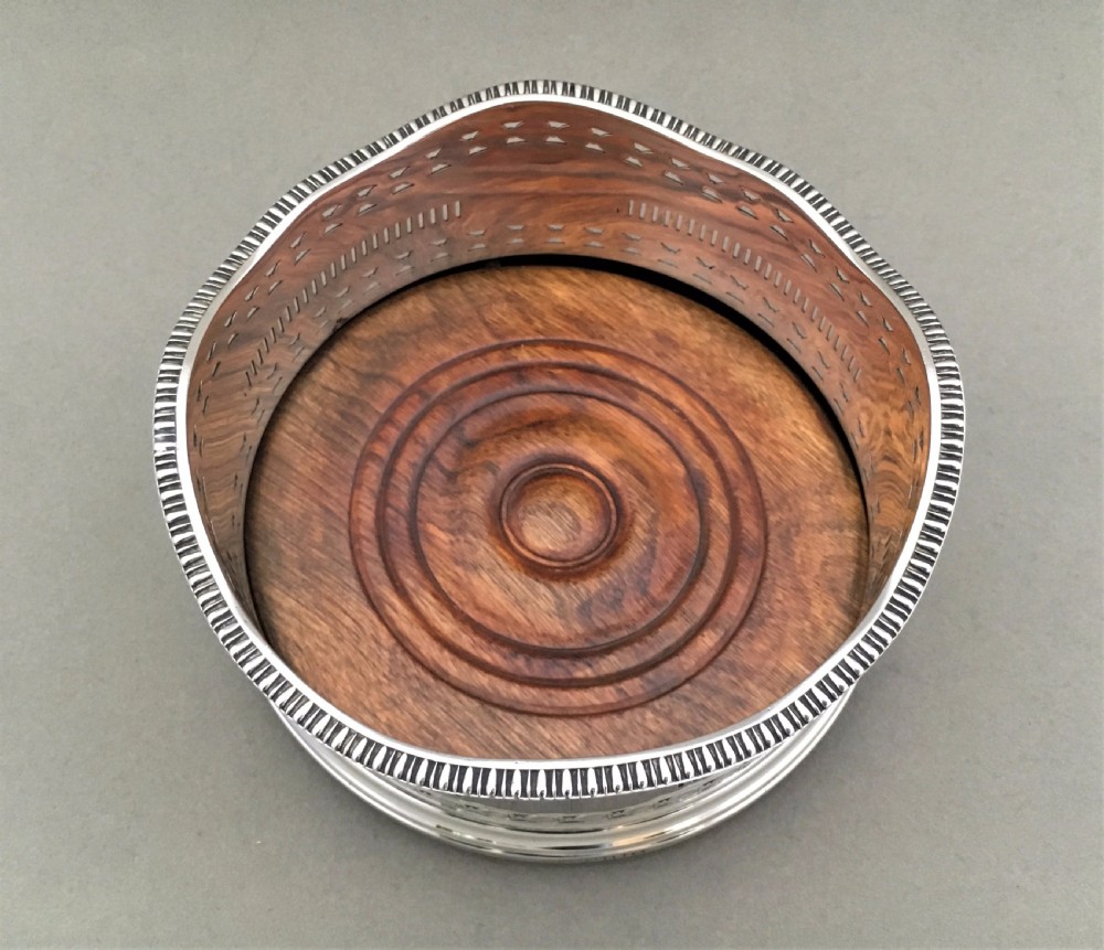 An excellent George V pierced silver wine bottle coaster View III