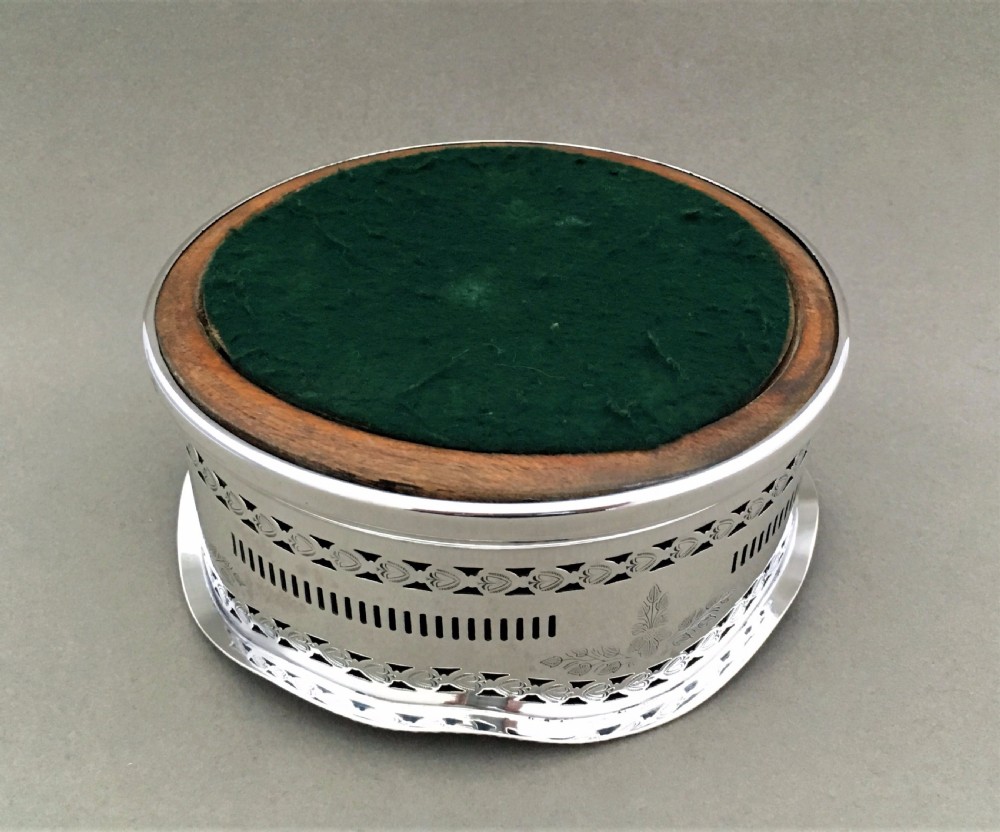 An excellent George V pierced silver wine bottle coaster View IV