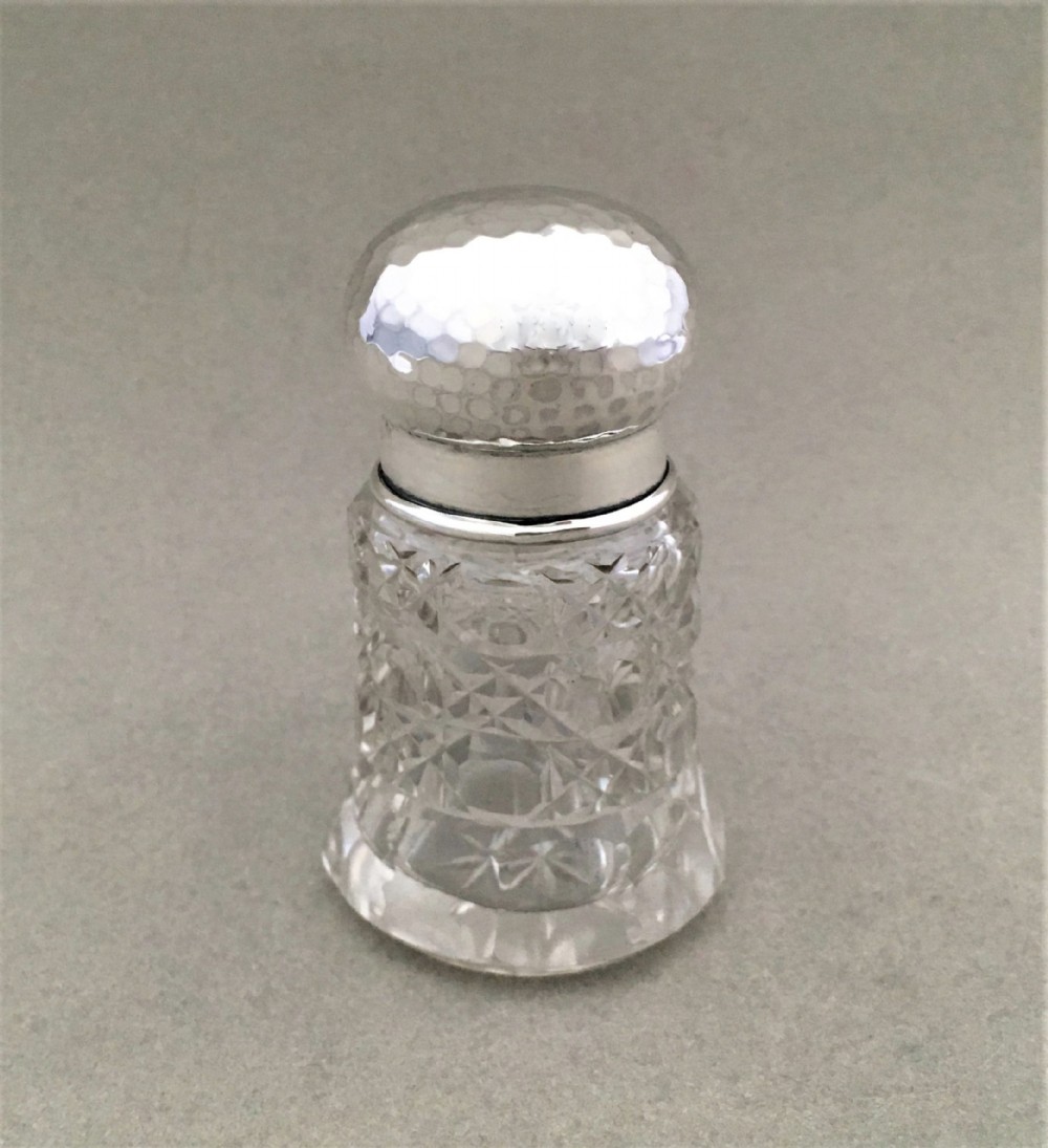 A silver mounted scent bottle in the arts and crafts style