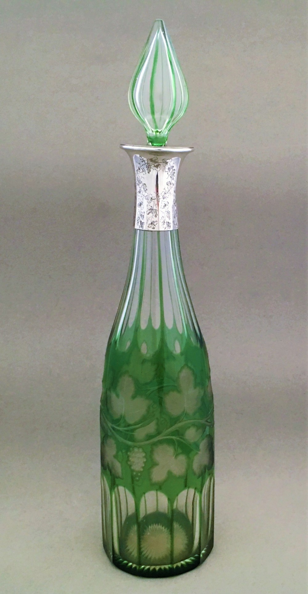 A stunning silver mounted fruiting vine decanter