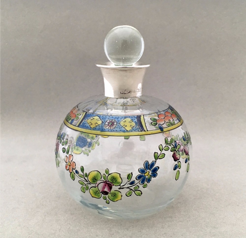 A gorgeous silver mounted & enamel painted scent bottle