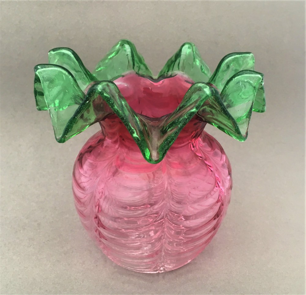 A rare Victorian cranberry & green posy vase
