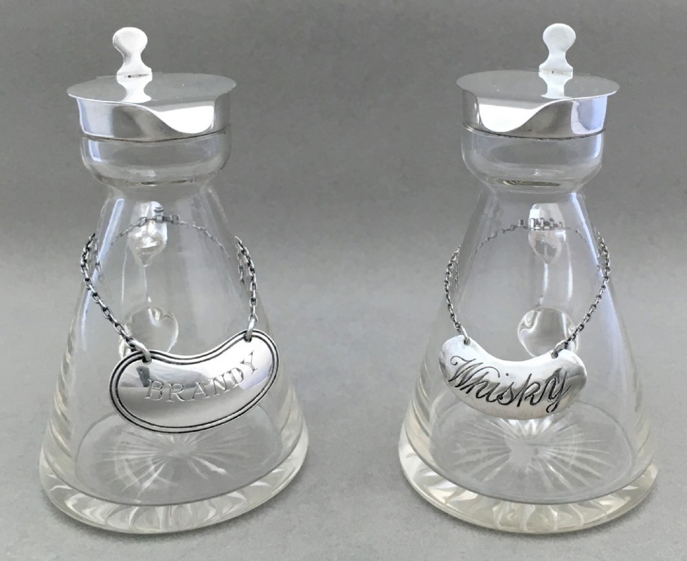 A pair of silver mounted Brandy & Whisky Noggins