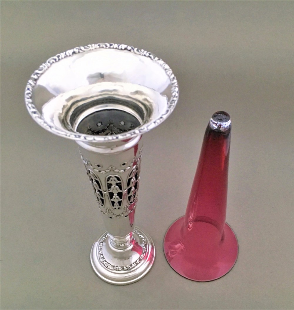 A stunning silver and cranberry pierced trumpet vase View VIII