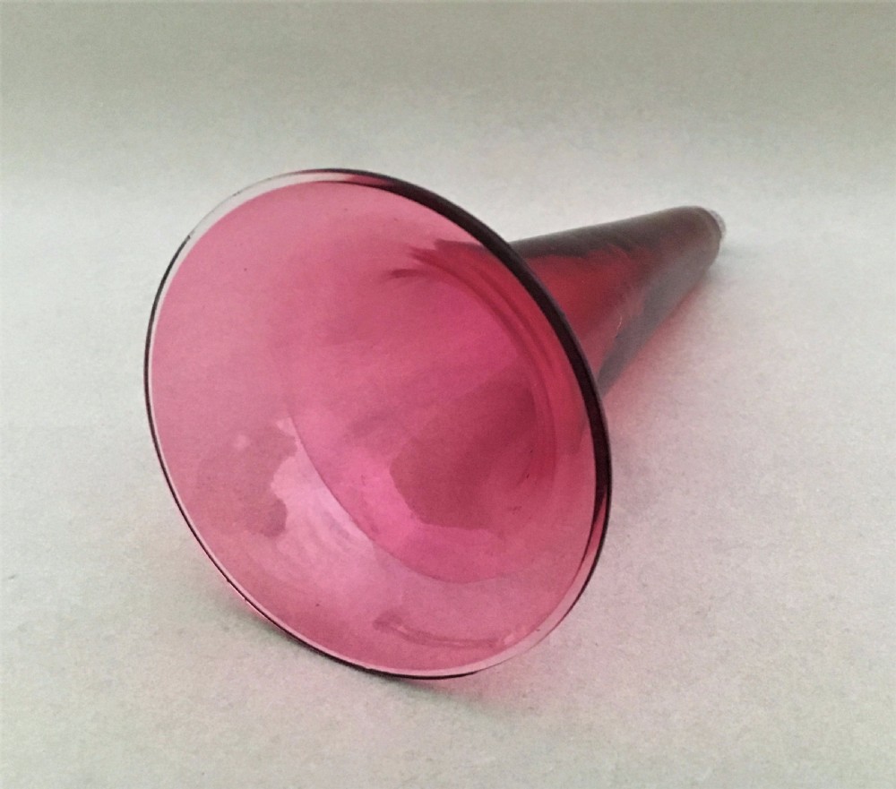 A stunning silver and cranberry pierced trumpet vase View IX