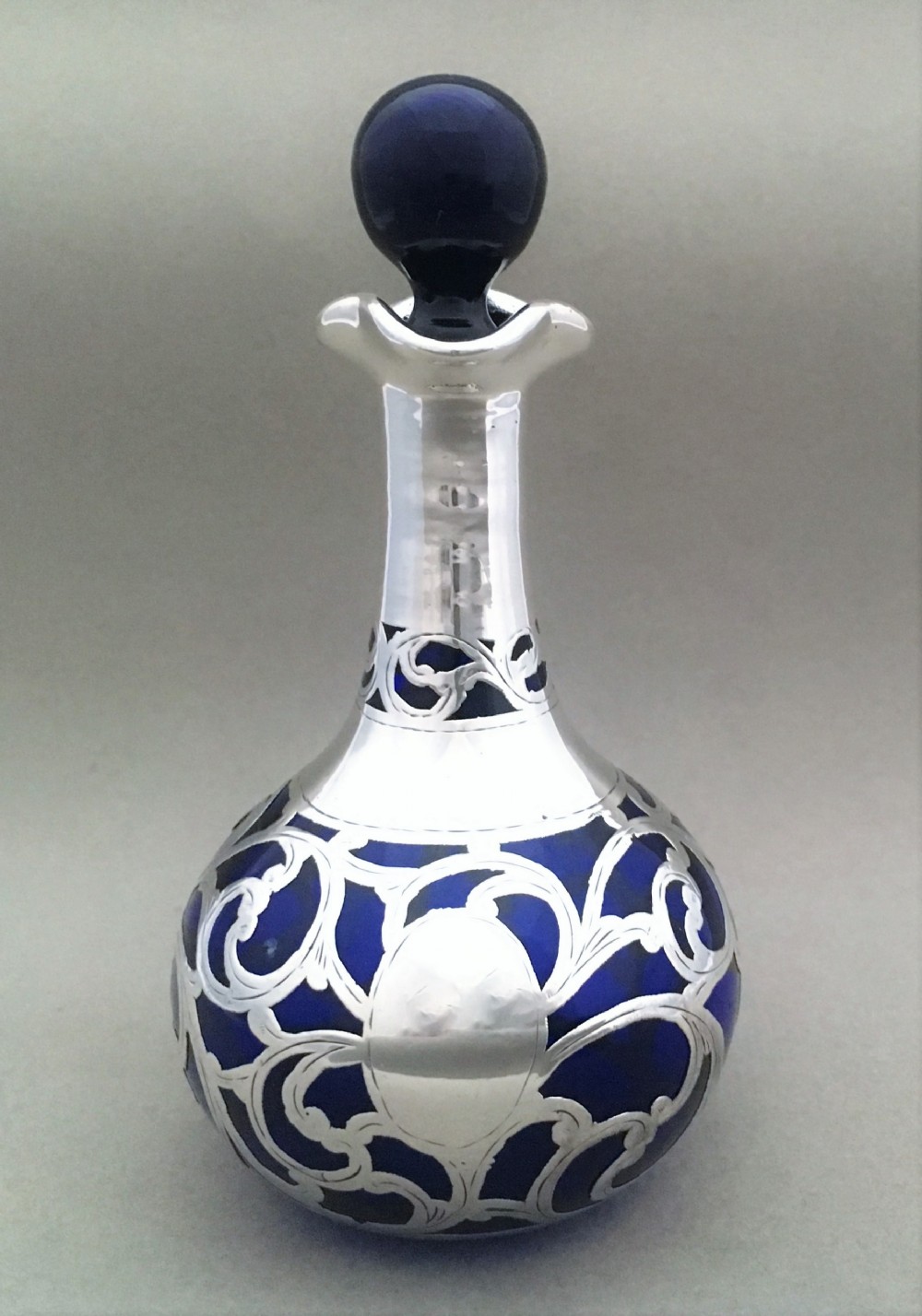 A Bristol blue Victorian silver overlay scent bottle