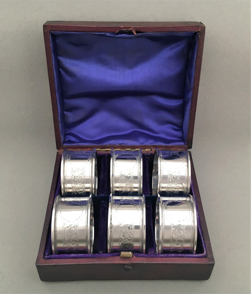 A rare set of six boxed silver napkin rings