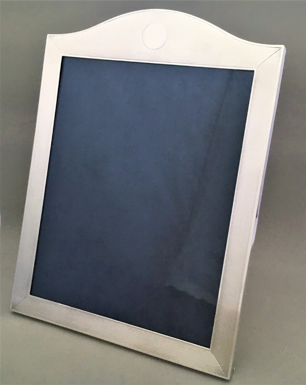 An excellent large silver engine turned photo frame