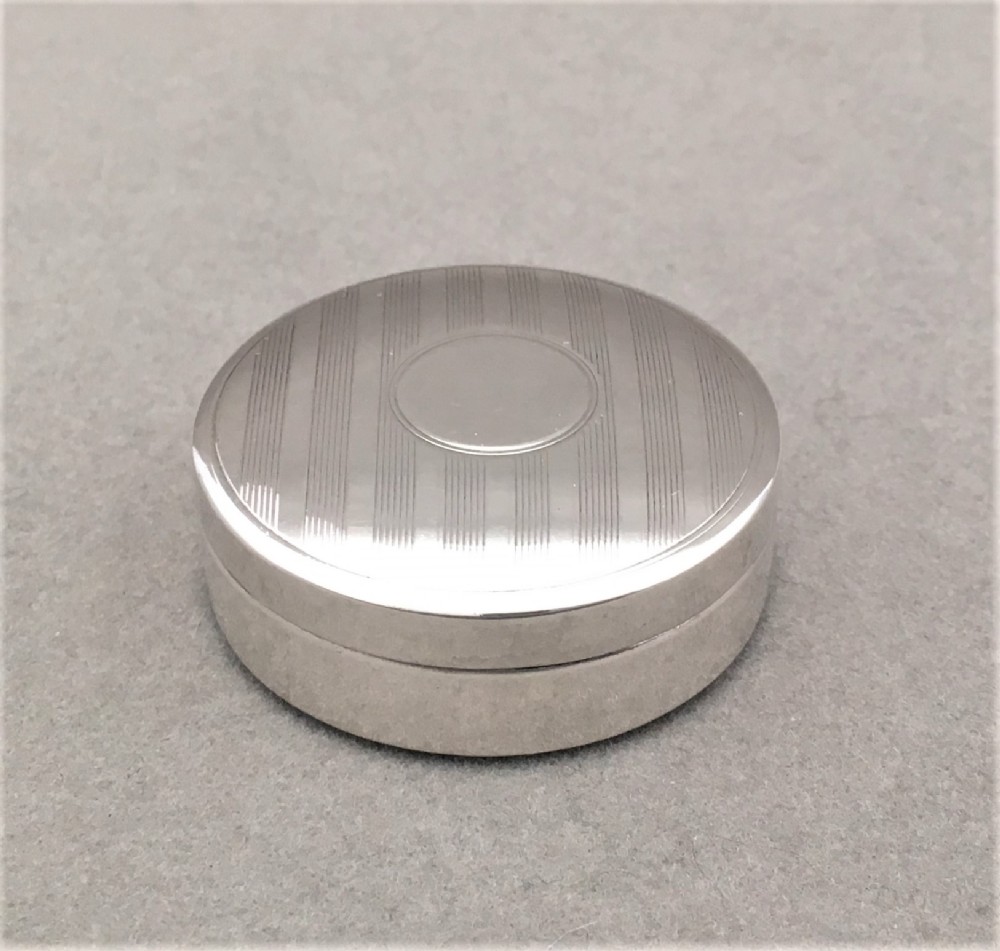 A charming engine turned silver pillbox