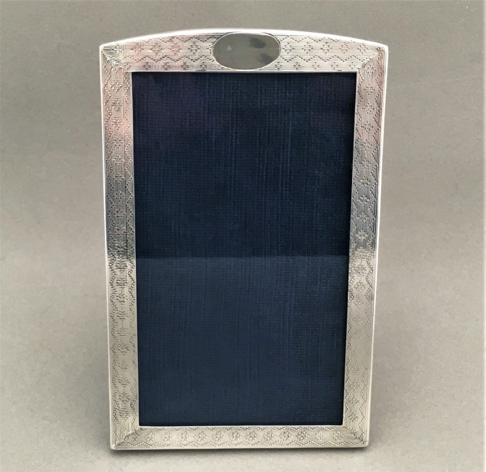 A lovely silver engine turned photo frame