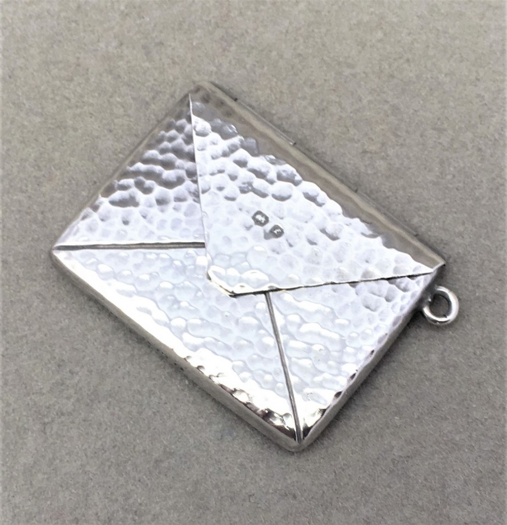 A lovely Arts & Crafts silver stamp case