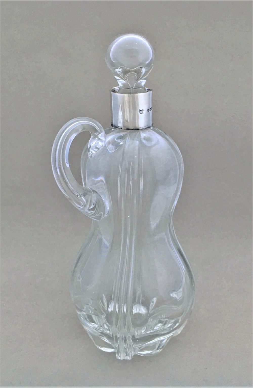 A charming silver mounted olive oil or vinegar bottle