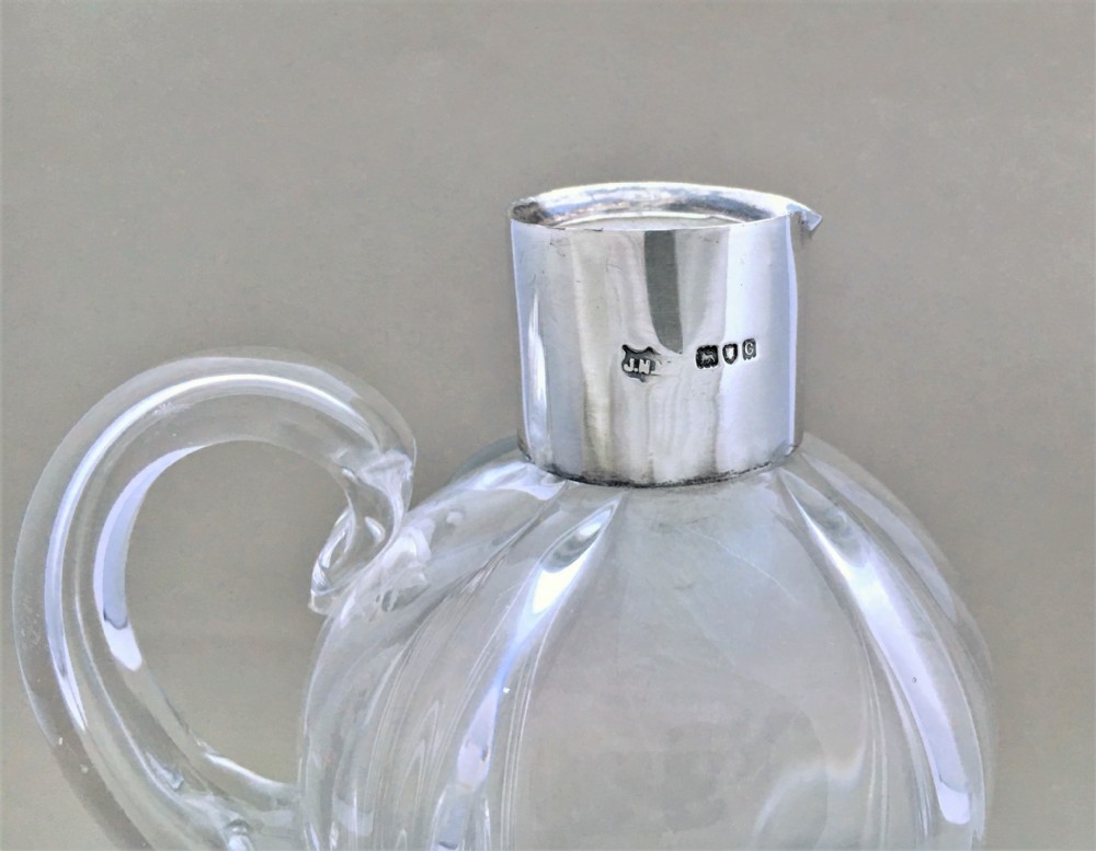 A charming silver mounted olive oil or vinegar bottle View III