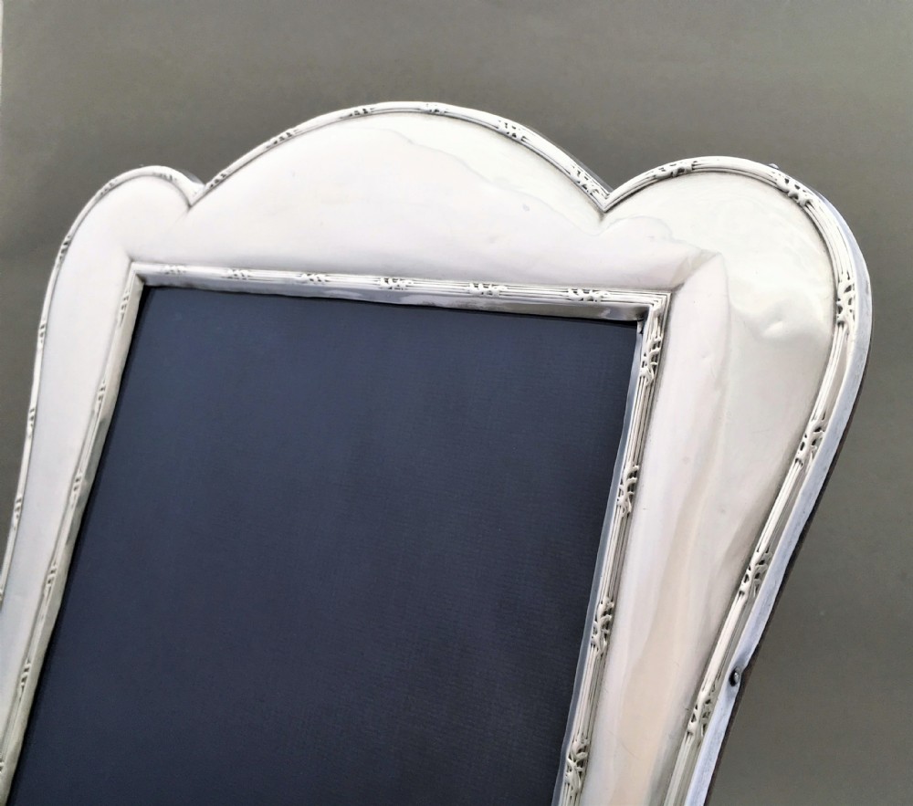A decorative shaped silver photo frame View V