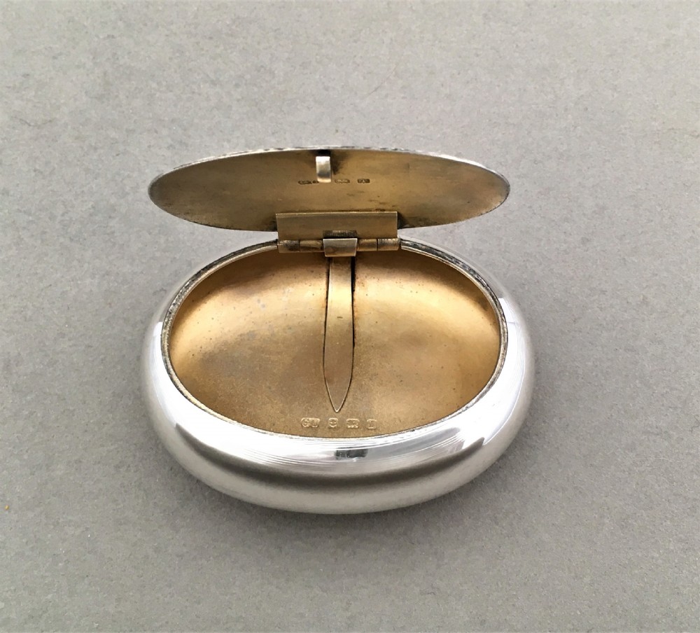 A charming Edwardian silver oval tobacco box View VI
