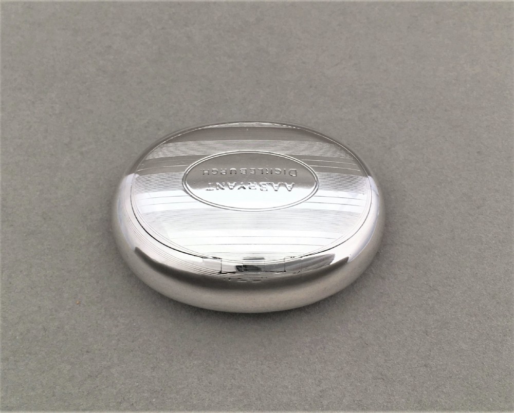 A charming Edwardian silver oval tobacco box View II