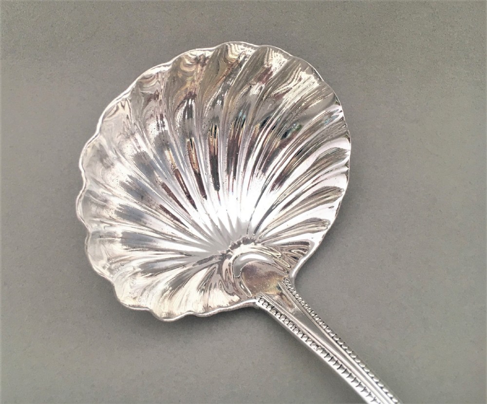 A superb George III silver shell bowl soup ladle View V