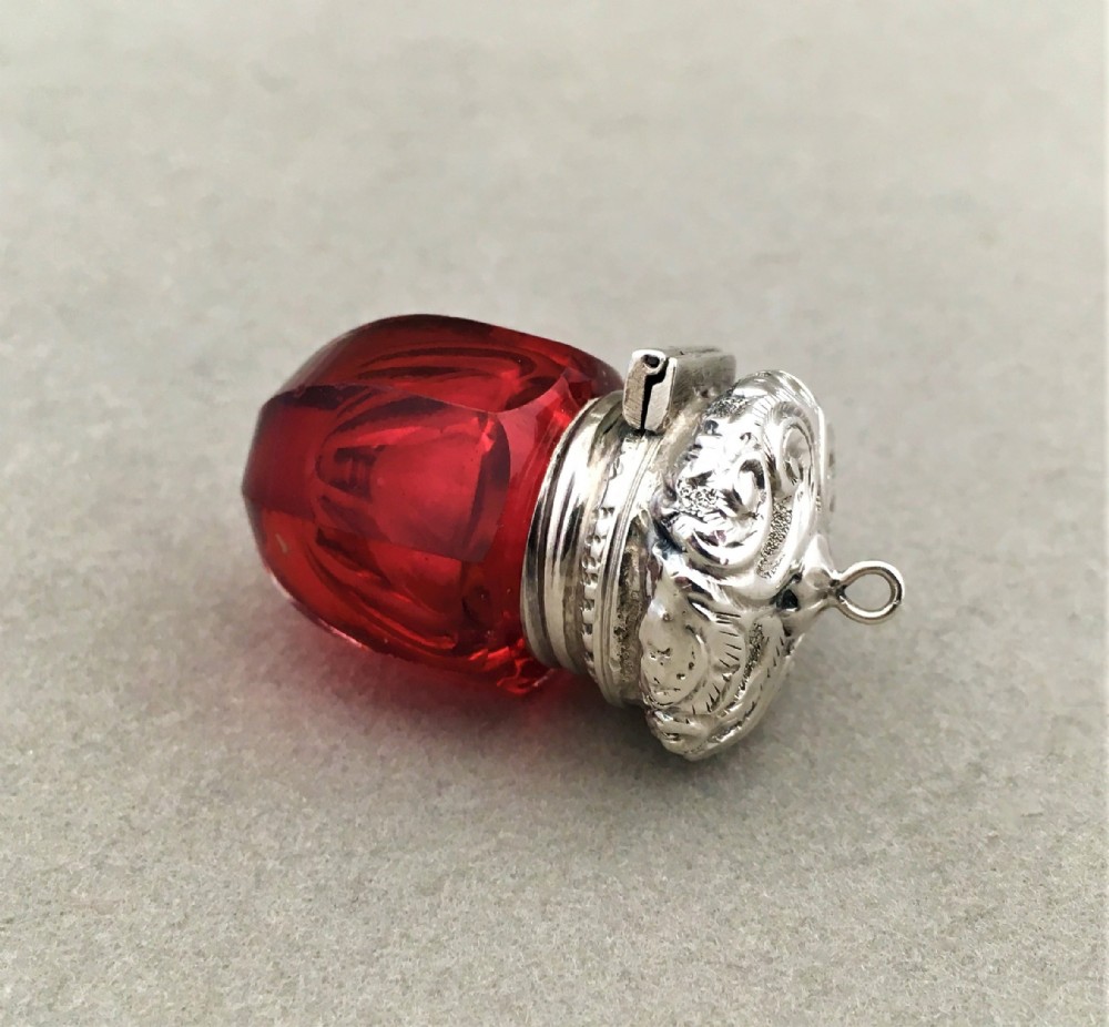 A rare silver mounted acorn shaped vinaigrette