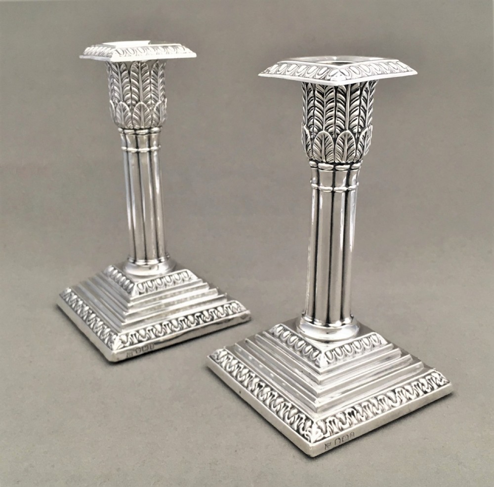 A wonderful pair of silver corinthian column candlesticks