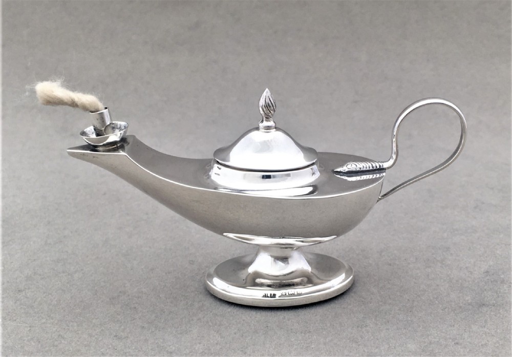 A gorgeous silver miniature table lighter