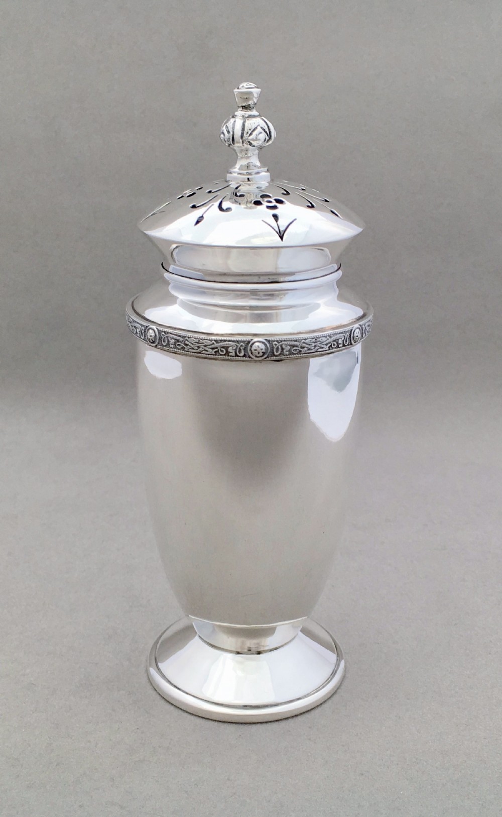 A stylish silver sugar caster