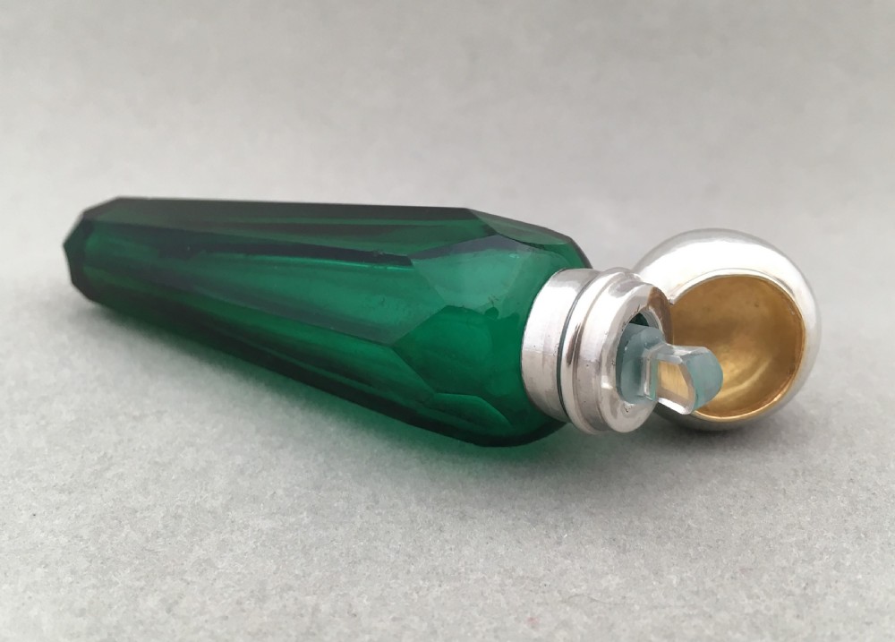 A Victorian icicle form silver mounted scent bottle