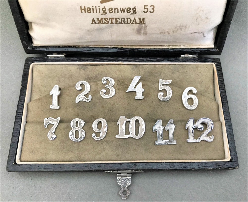An unusual boxed set of silver party numbers View II
