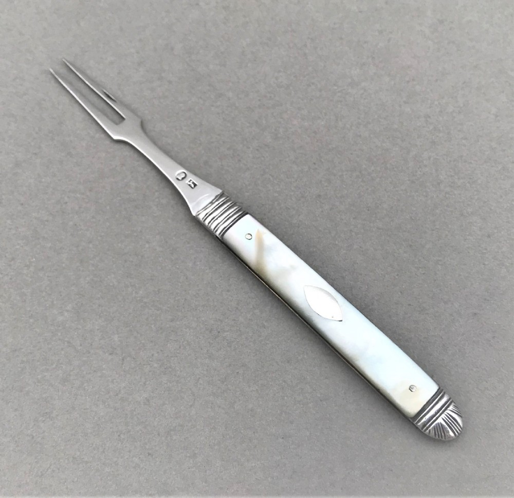 An Exquisite 18th Century Silver folding fruit fork.