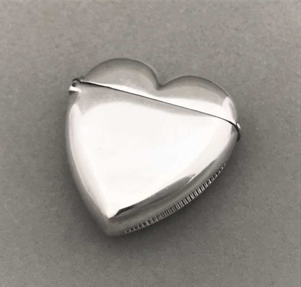 An unusual Edwardian silver vesta in the shape of a heart.