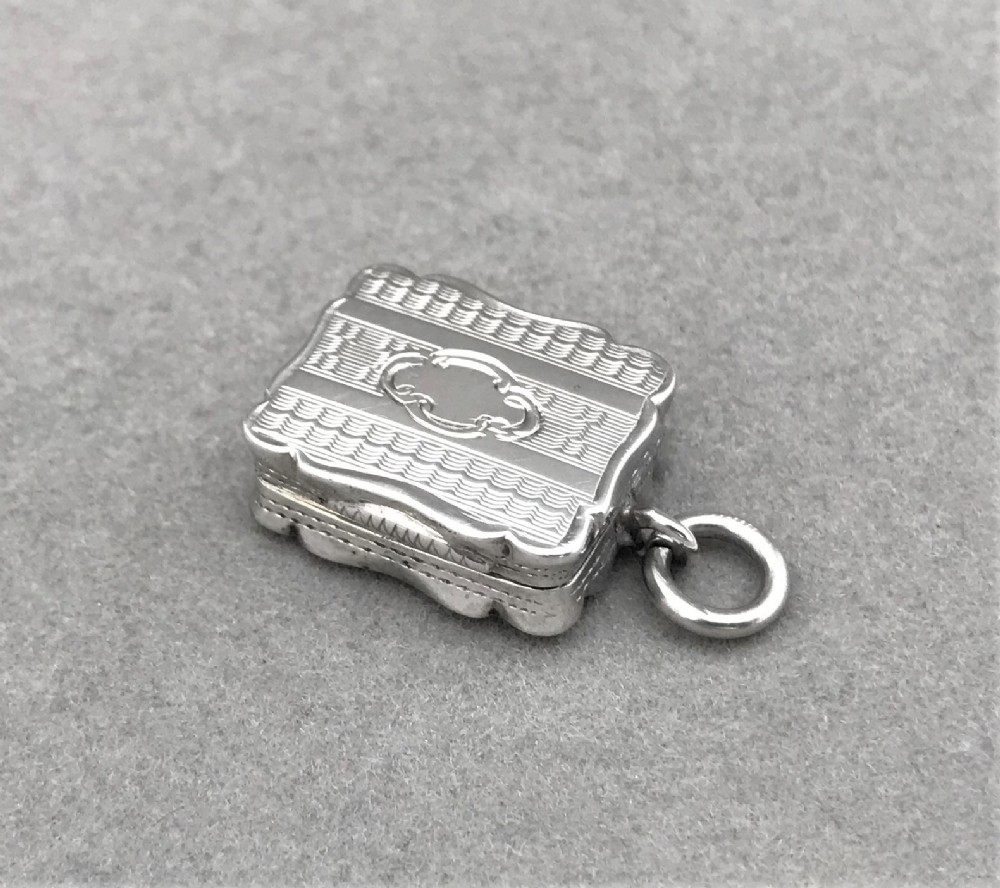 An exquisite miniature Victorian silver vinaigrette