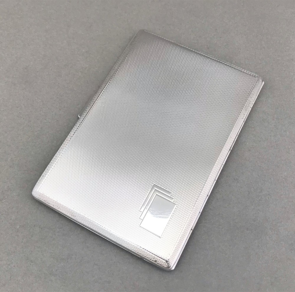 A handsome Art Deco silver cigarette case