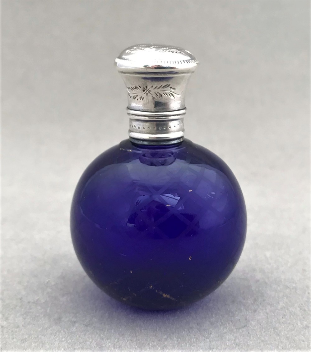 A gorgeous silver mounted mid 19th Century scent bottle