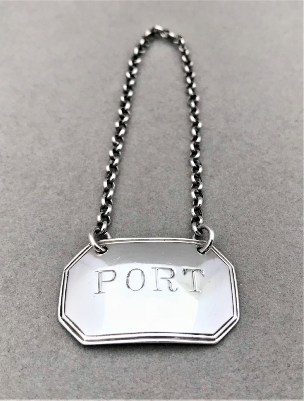 A George III silver Port label