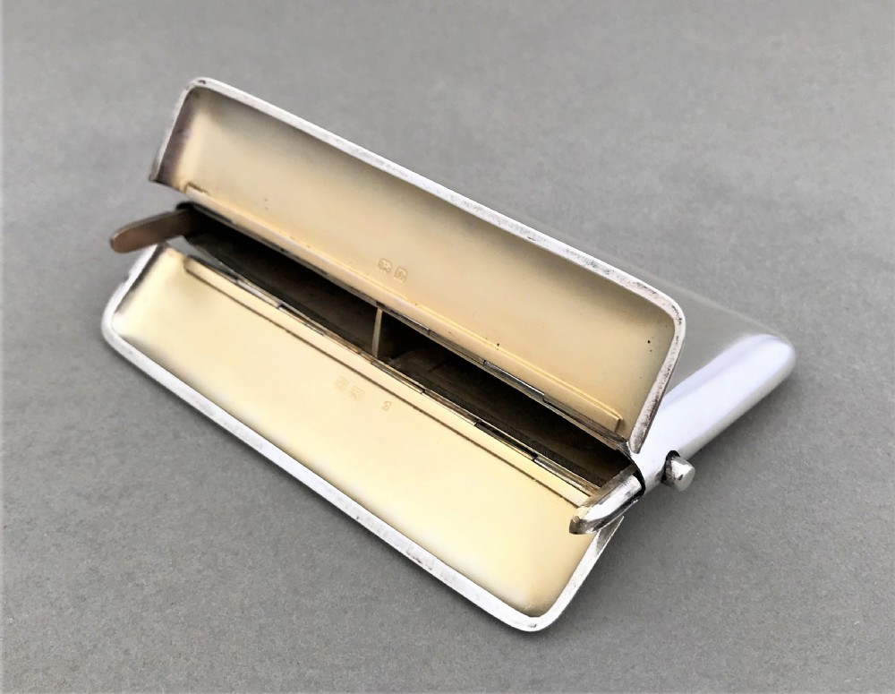 An unusual silver sprung card or cigarette case