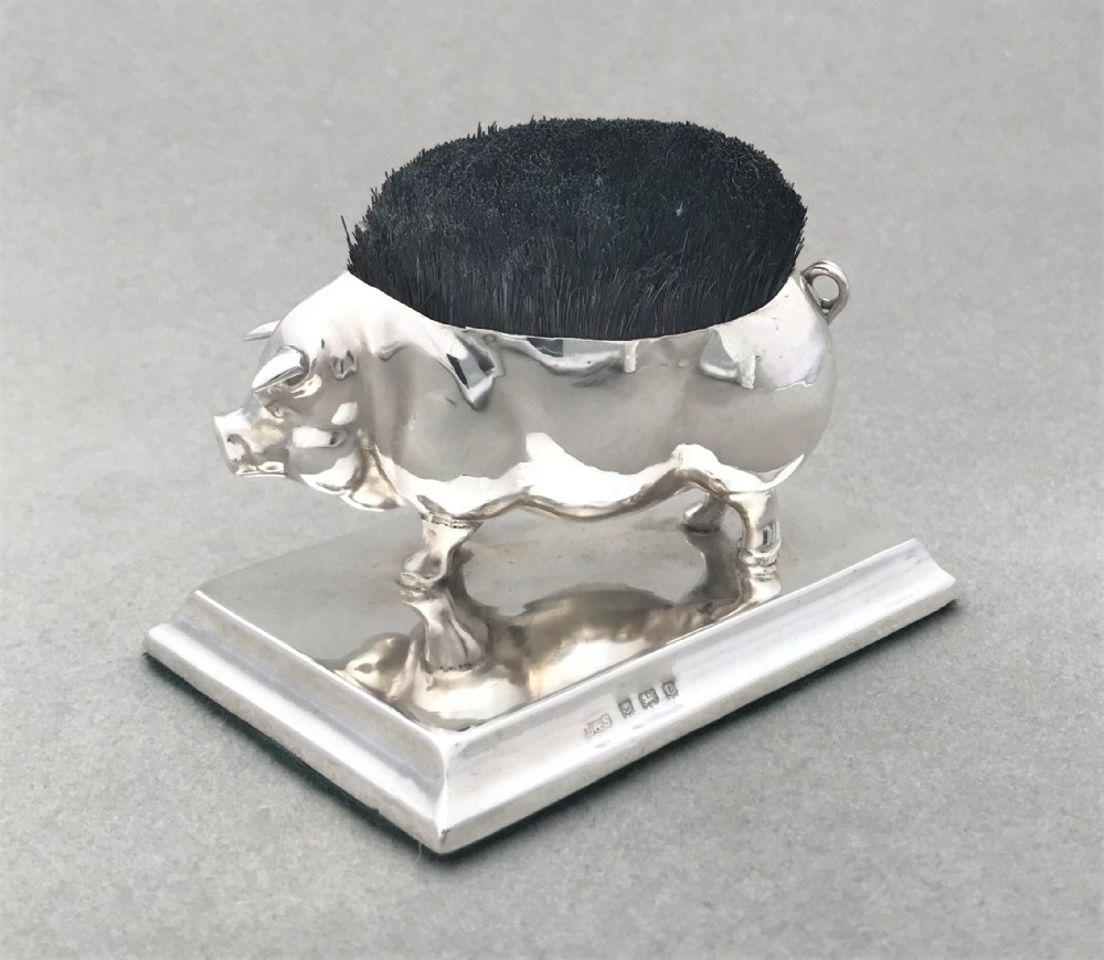 A fantastic silver novelty pig pen wipe